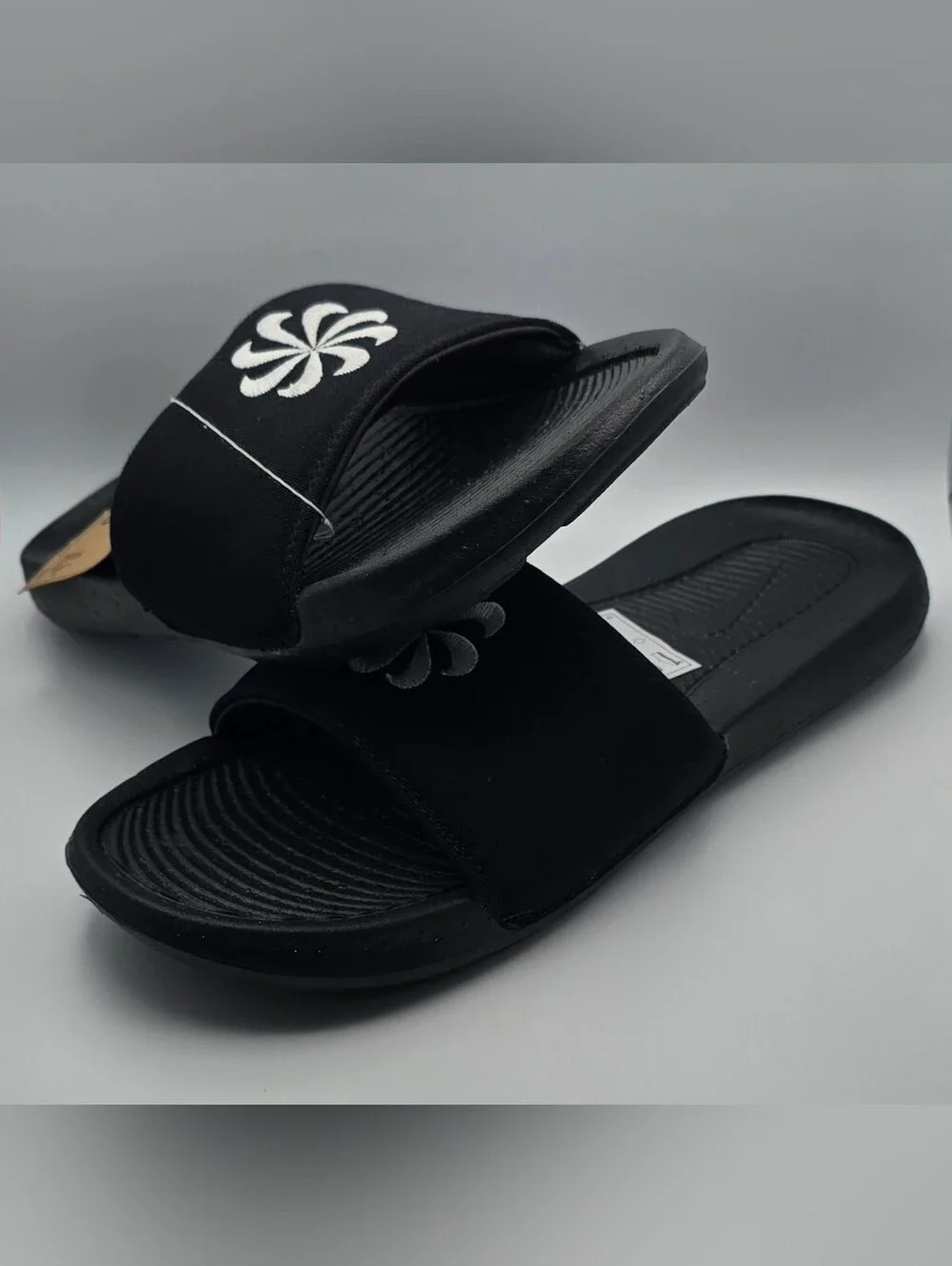 Nike Victori One Black Slide Sandals with White Floral Logo